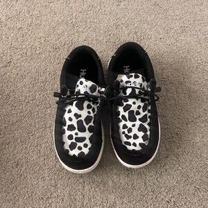 Black and White Cow Print Slip-On Sneakers